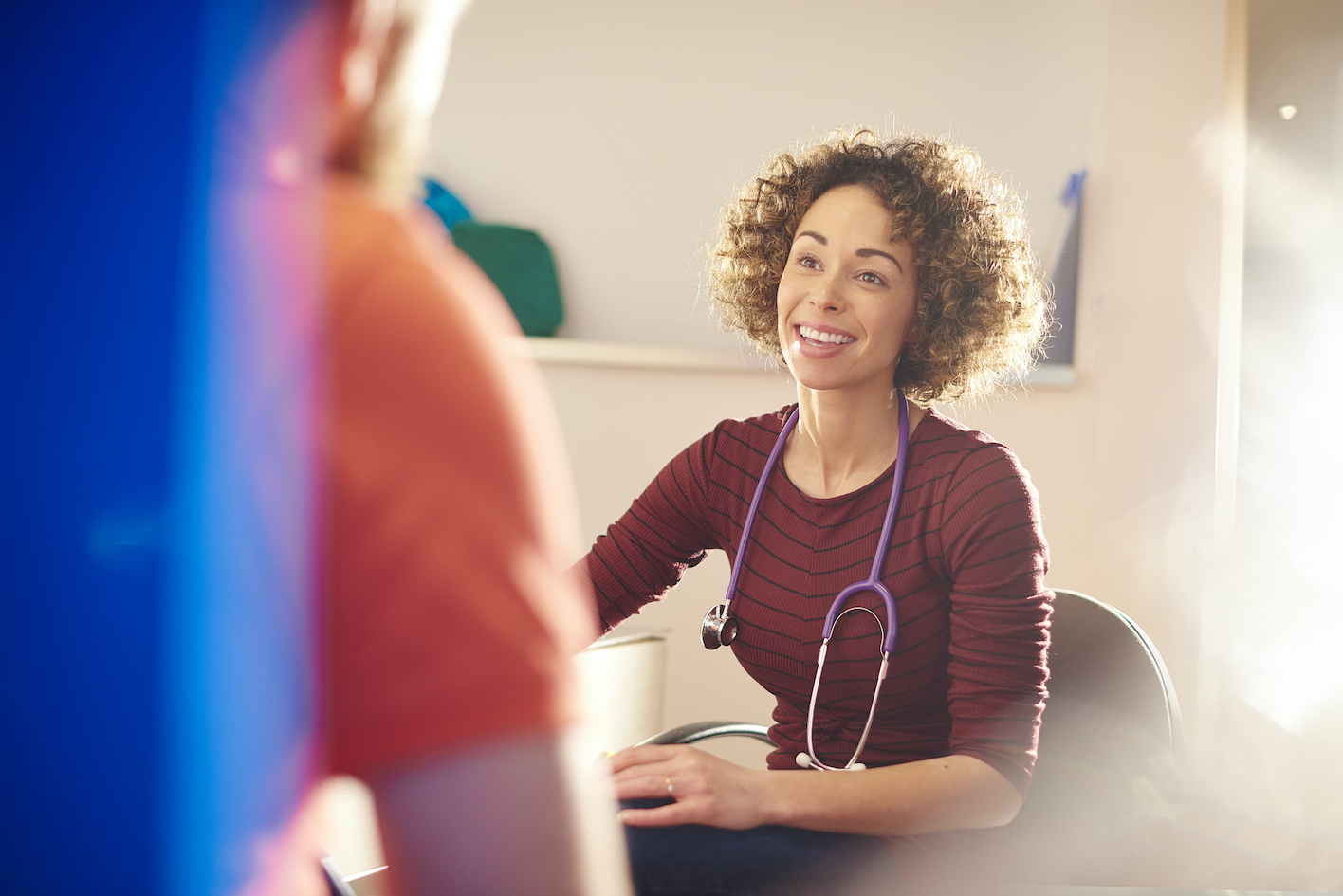 happy female doctor with patient